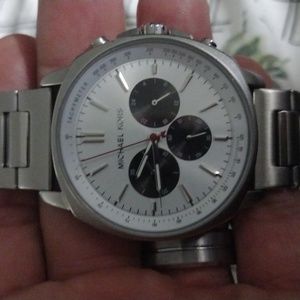 This is a real deal MK Watch. Silver with beautiful white face.
